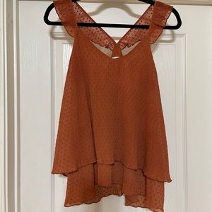 Burnt orange sleeveless blouse